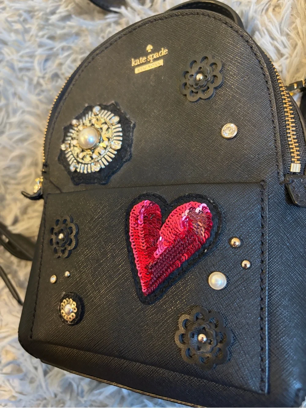 kate spade black mini backpack with red sequin heart and floral studs